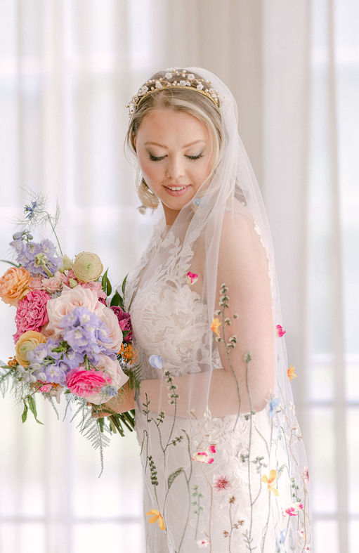 Anastasia floral veil by Adorn Bridal by Ashley
wildmeadow style flowers trailing up a bridal veil scattered with embelished flowers
photographer karljoanephotography