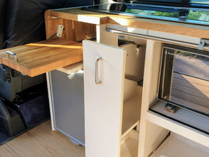 VW T5 transporter custom kitchen with pull-out storage.