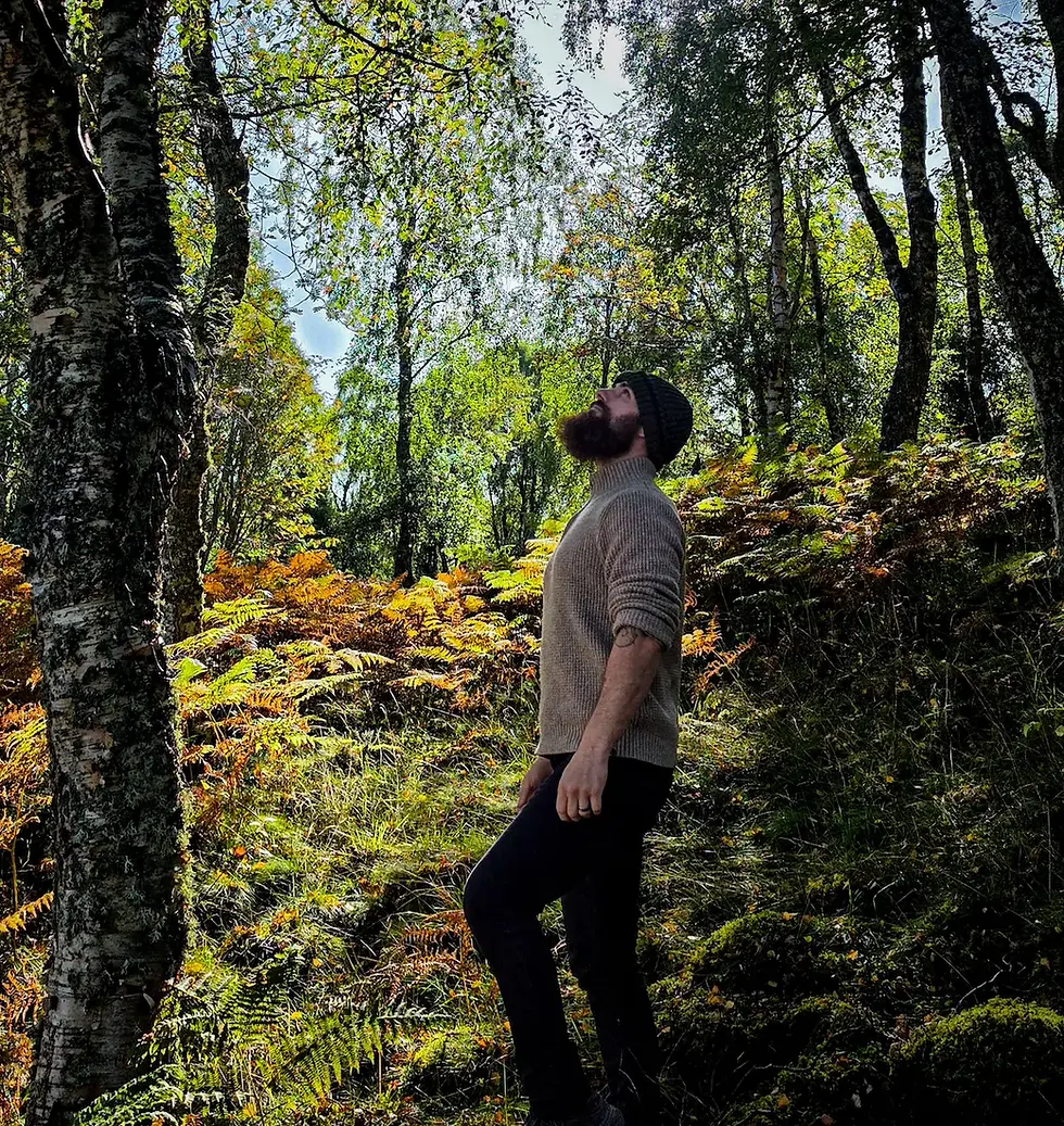 Hairy Highlander founder foraging wild chaga in an ancient birch forest in the Scottish Highlands