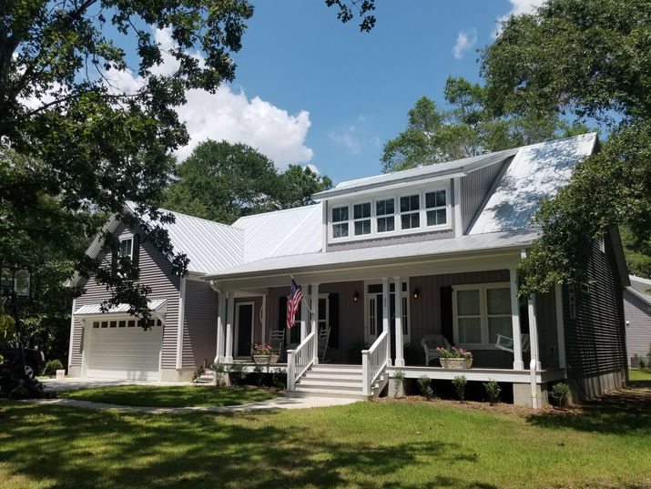 Two-story gray house with white trim and a front porch