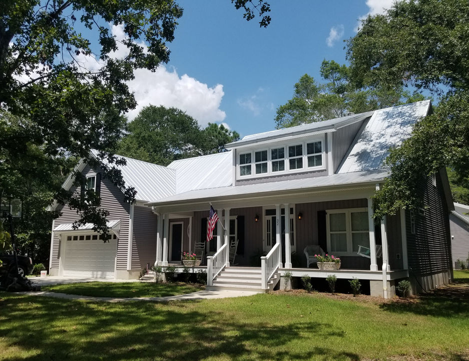 Two-story gray house with white trim and a front porch