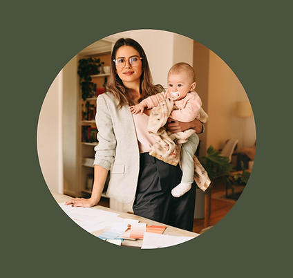 Working mother in home office, holding her young baby
