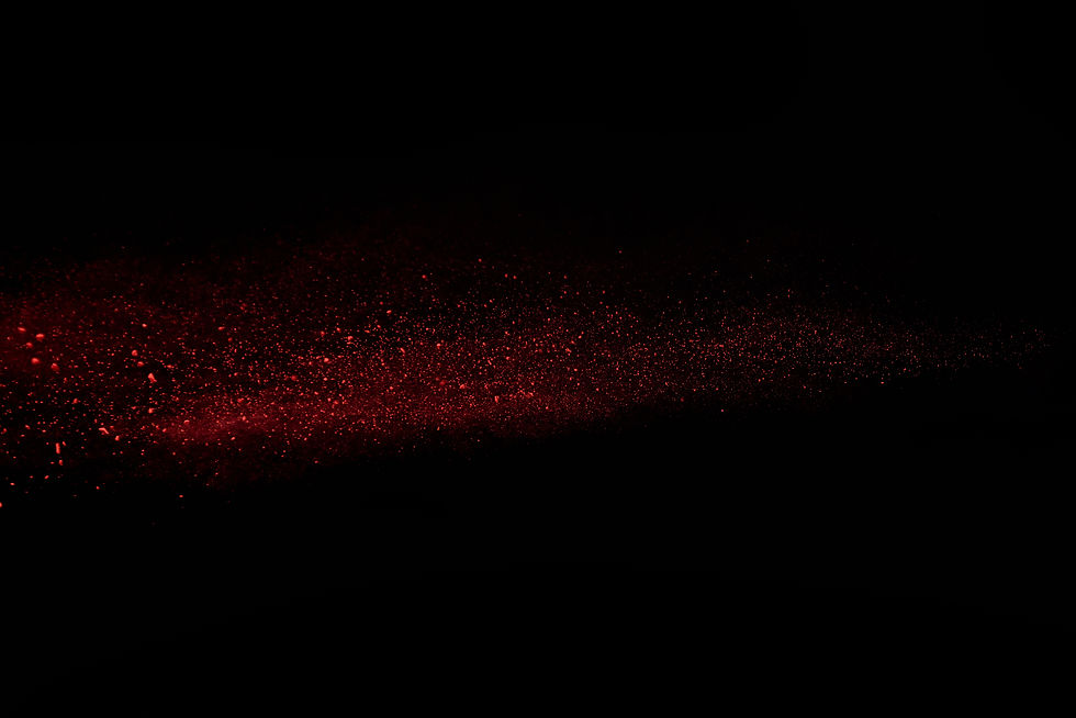 red-powder-in-air-and-falling-down-on-black-backgr-2024-11-17-20-32-10-utc_edited.jpg