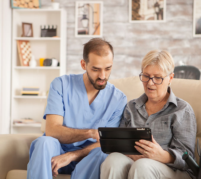 male-bearded-doctor-in-nursing-home-helping-senior-2025-02-19-21-03-25-utc.jpg