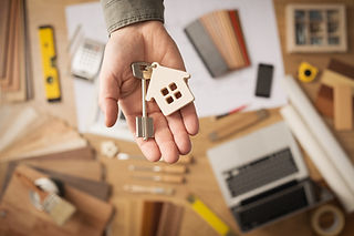 A homeowner handing off their keys to a tenant.