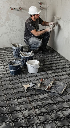 Guy working on top of flooring protection