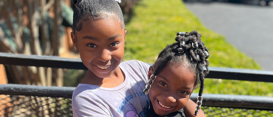 Sisters hugging after dad's death