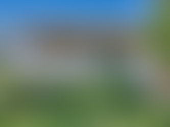 South façade of Passive House residence in Greenport, New York with clean modern detailing and energy-efficient window design