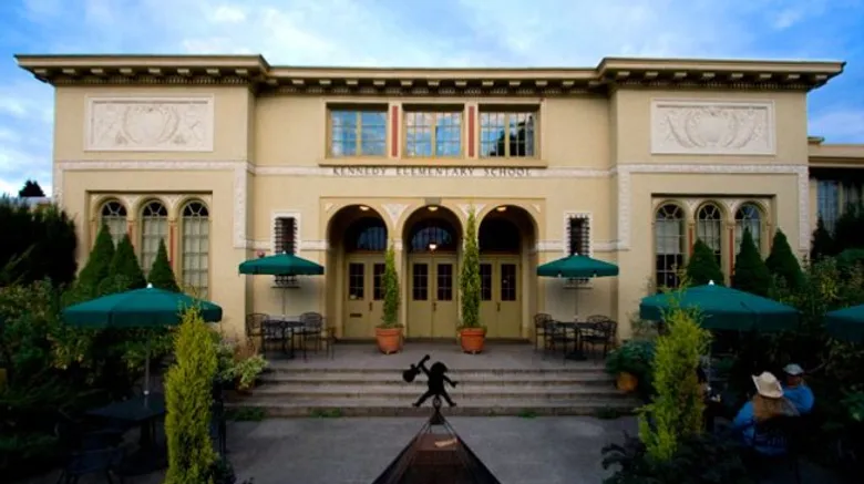 McMenamins-Kennedy-School-Hotel-Exterior.webp