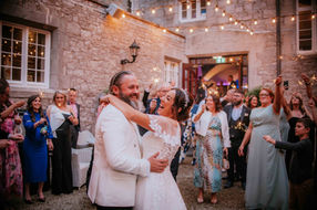 fun and relaxed wedding photography at markree castle, bride and groom share a laugh during first dance