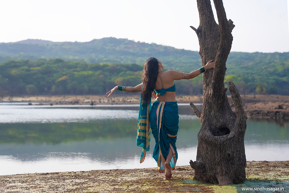 "Even as she lifts the water-pot to her head, her waist bends like a vine in the wind. O traveller, why do you hurry? Stay a little. The road can wait."  -Gatha Saptashati    She is not the nayika of perfumed chambers. She is closer to the poetry of a couplet  immediate, unadorned and devastating.Someone who doesn't mind disappearing into the ripple of water or rising on wind like a bird's feather has already made her peace with impermanence. 