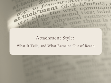 Close-up photograph of a dictionary entry for the word "attachment", in soft focus.