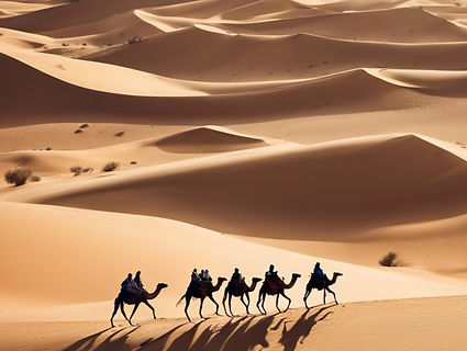 tourists riding camels over desert dunes