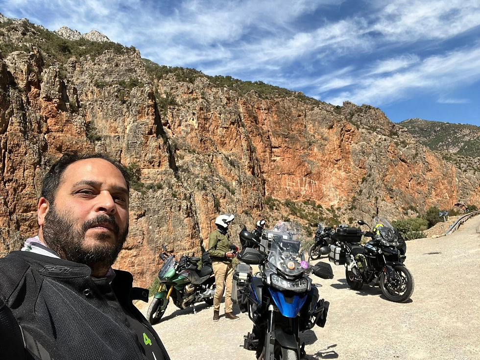 Eye-level view of narrow winding road through green Rif mountains