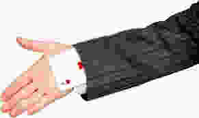 card trick being performed by a magician using sleeve and hand