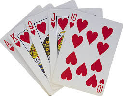 a stack of playing cards displaying hearts of Kings, Queens, Jacks, Aces and a ten