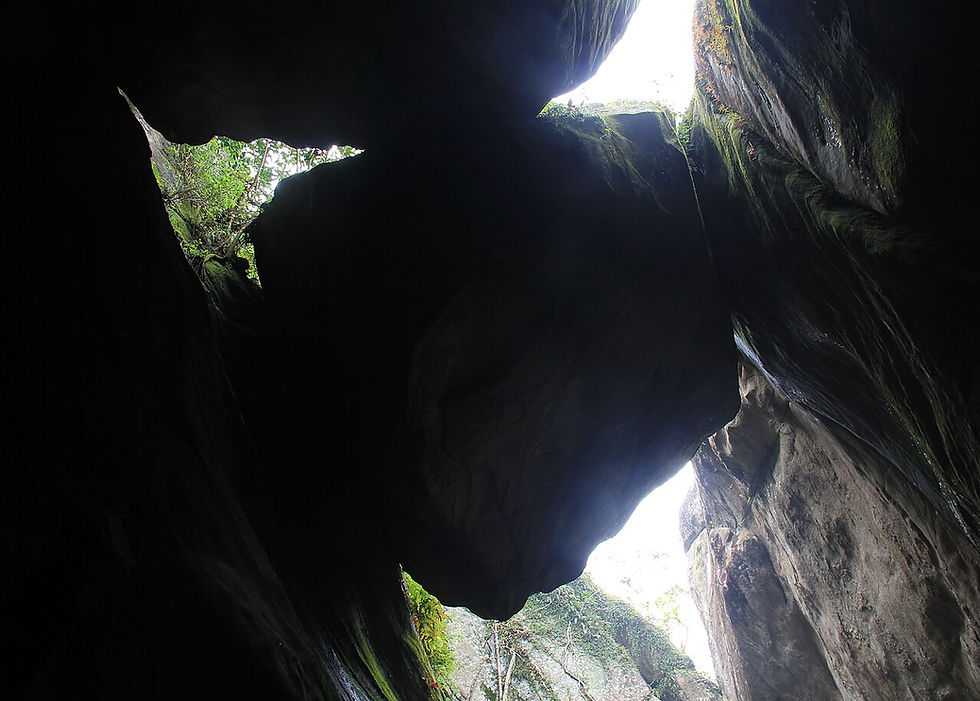 The gigantic rock stuck between two rocks 'edakkal' at the Edakkal Caves in Wayanad, Kerala, India. Image Courtesy: Abin jv at Malayalam Wikipedia, CC BY-SA 3.0 <https://creativecommons.org/licenses/by-sa/3.0>, via Wikimedia Commons