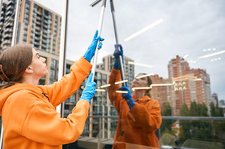 young-cleaning-company-worker-washes-windows-with-2023-11-27-05-17-43-utc.jpg