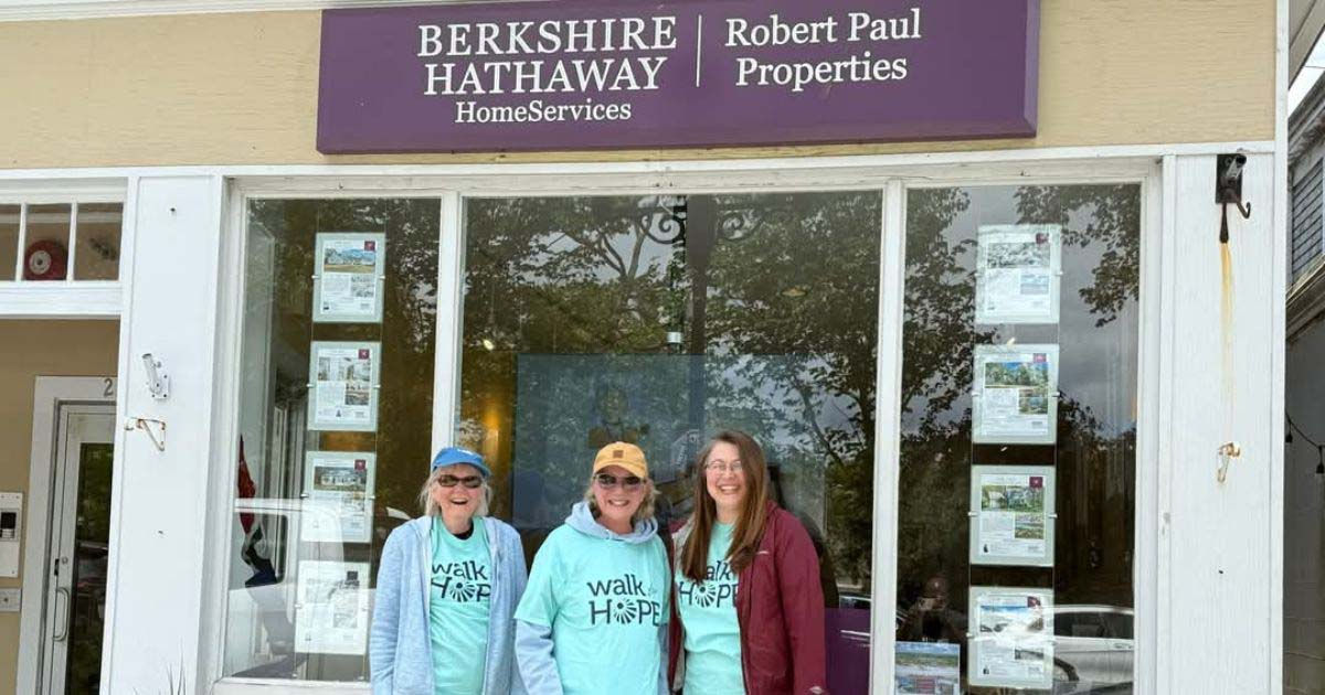 Berkshire Hathaway HomeServices Robert Paul Properties Falmouth office with three agents ready for a charity walk