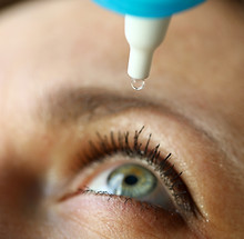 Woman drops eye drops to check vision, prevention. Comprehensive diagnostic examination. I