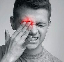 Tired exhausted man suffering from strong eye pain, touching red painful eye, monochrome p