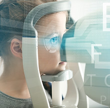 Little girl visiting an optician. Ophthalmologist concept.jpg