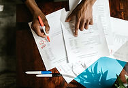 person at desk checking county court forms