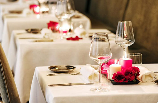 Fresh white tablecloths laid for restaurant service in Bolton North West