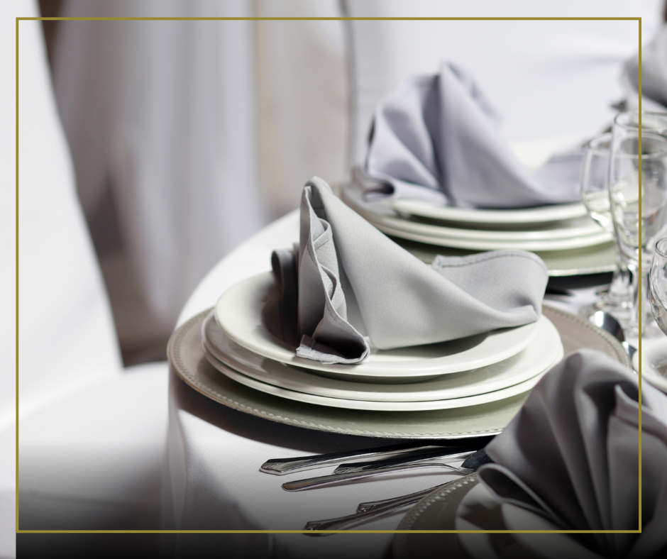 Elegant white linen napkin neatly folded on a restaurant table, adding a clean and professional touch to the dining setup.