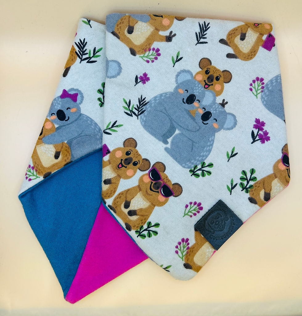 Cuddling Koala with Blue and Pink Bandana