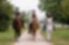 Three female riders riding horses along the trail. Recreation and leisure activity concept