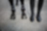 Horse and a rider's legs and feet next to each other.jpg