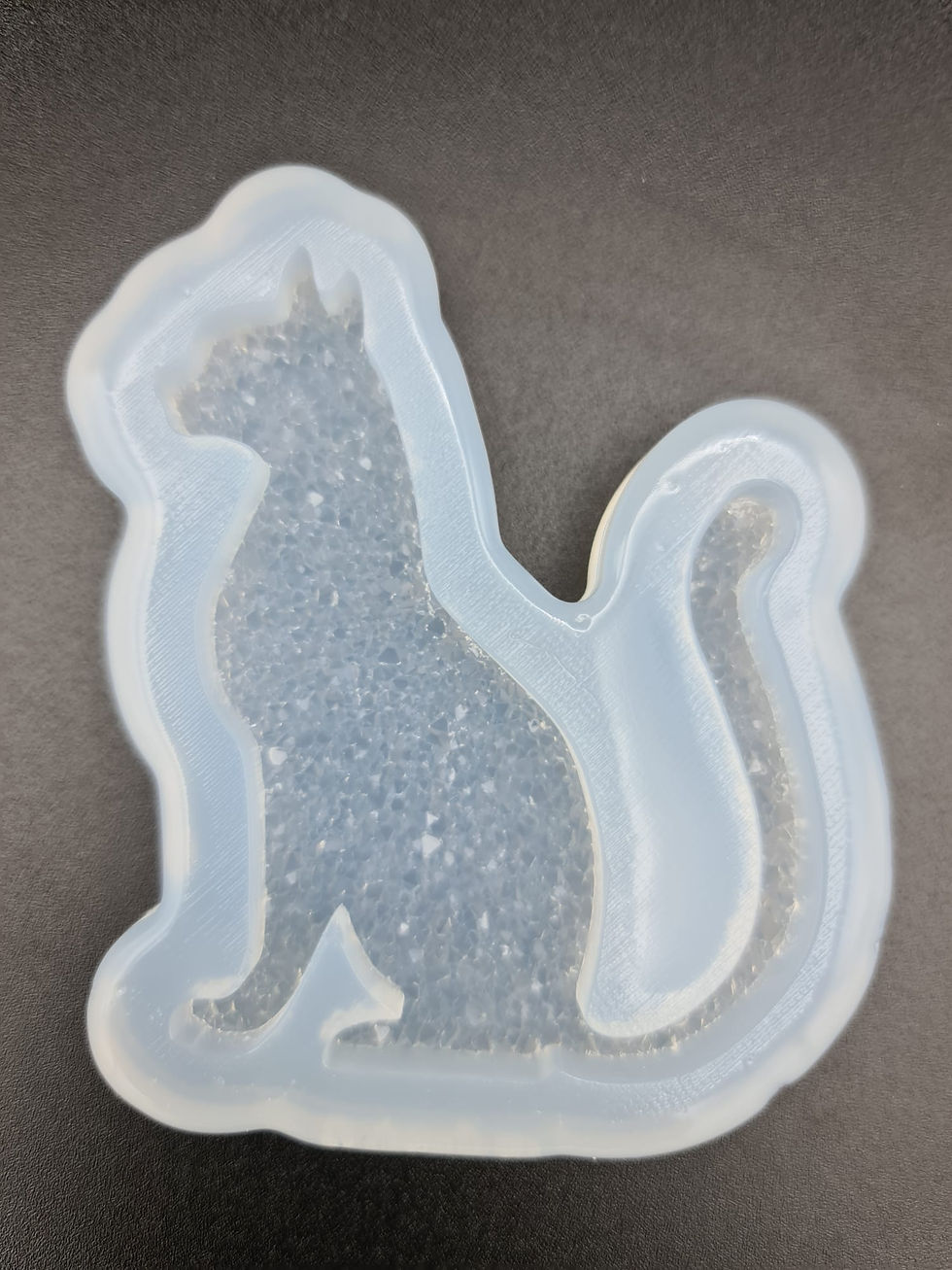 Small druzy cat mold facing right side.