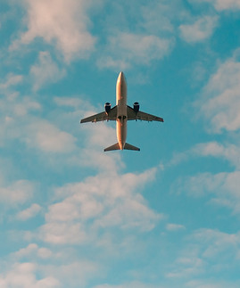 white airplane flying in the sky during 