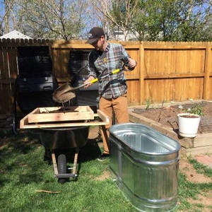 Cameron tests out his compost screen project.