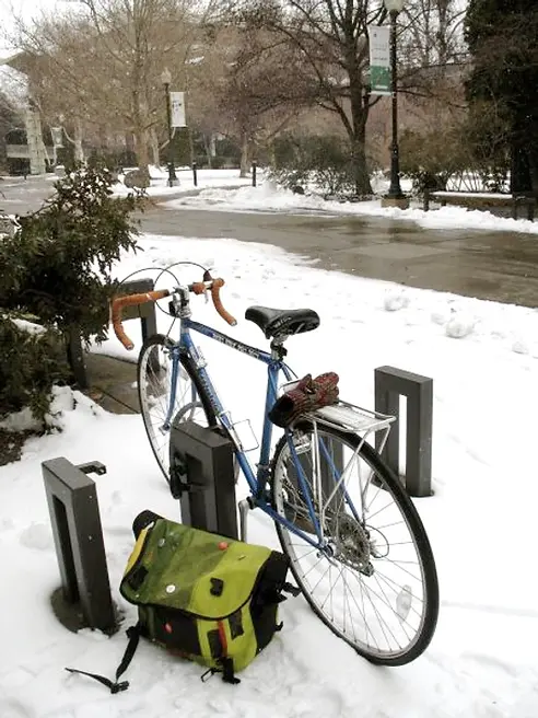 1986 Centurion road bike parked at a bike rack with snow on the ground in Reno Nevada