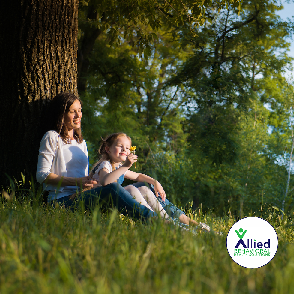 **Alt text:**
Parent and young child sitting together under a tree in a peaceful outdoor setting, representing family support, emotional well-being, and recognizing when stress, anxiety, or other mental health concerns may benefit from professional care and medication management.