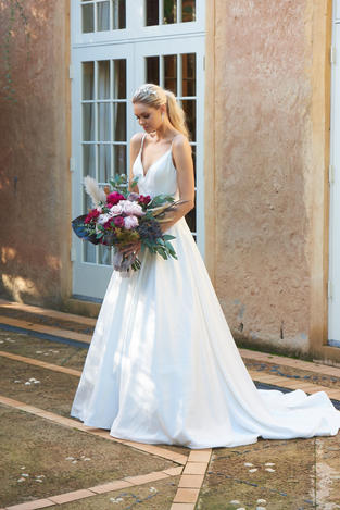 Aurora TC304 wedding dress, Aurora, Aurora Tania Olsen, Aurora TC304, Fitted bodice,
V-neckline,
Spaghetti straps,
Low v-back,
A-line silhouette,
Floor length skirt with train,
Soft satin fabric, SATIN DRESS, SATIN BRIDAL GOWN, POCKETS,
Fully lined,
Inner bra cups,
Low back zipper, Vintage white,
Style code: TC304, modern bridal gown, classic bridal gown, tania olsen wedding dress, wedding dress by tania olsen.