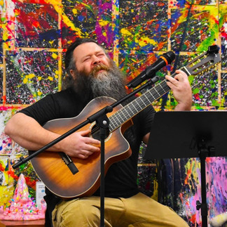 man performing at open mic