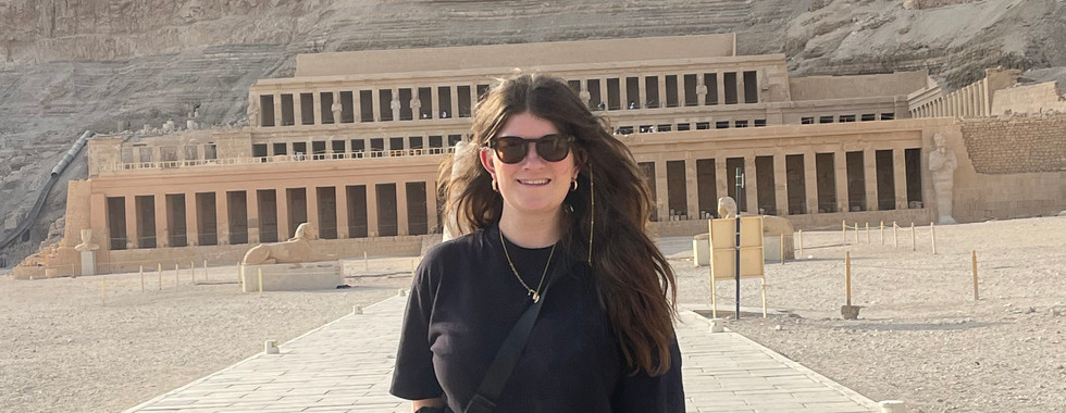 A young woman poses for a photo at the Mortuary Temple of Hatshepsut