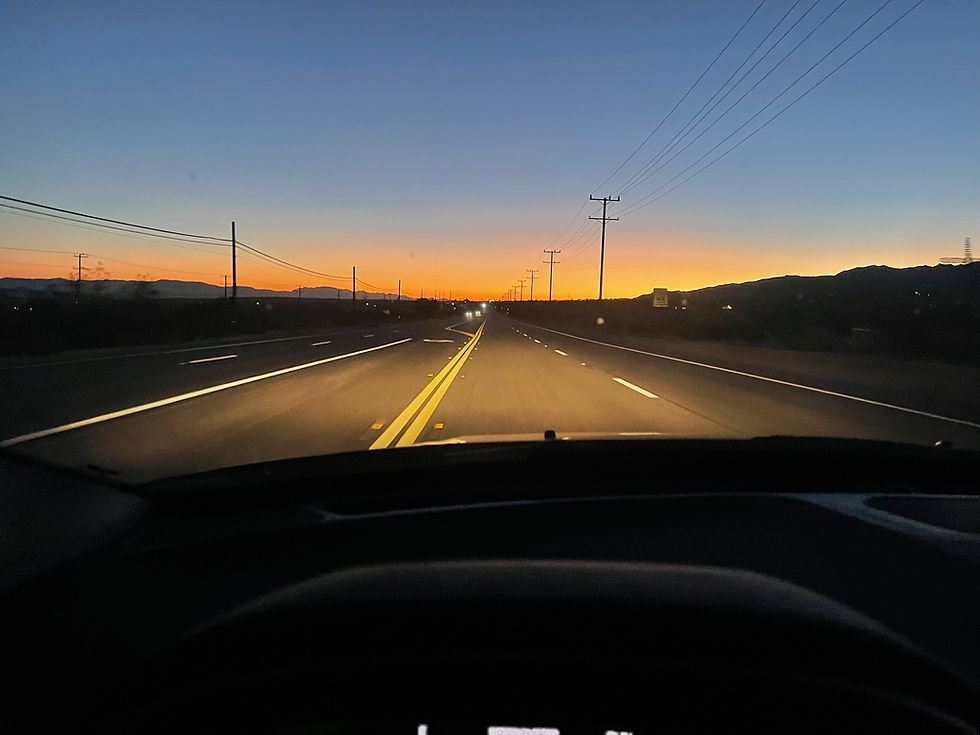 Sunrise over a road in the desert