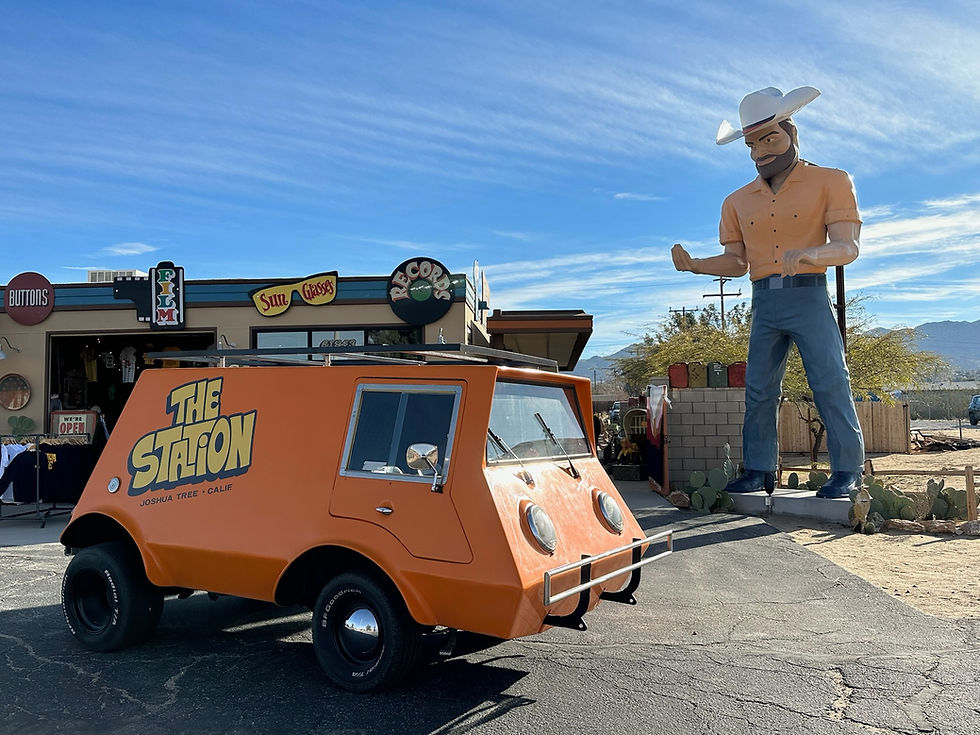 A trailer with a giant statue of a man