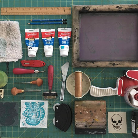 Printmaking Tools Layed out on a self-healing cutting mar