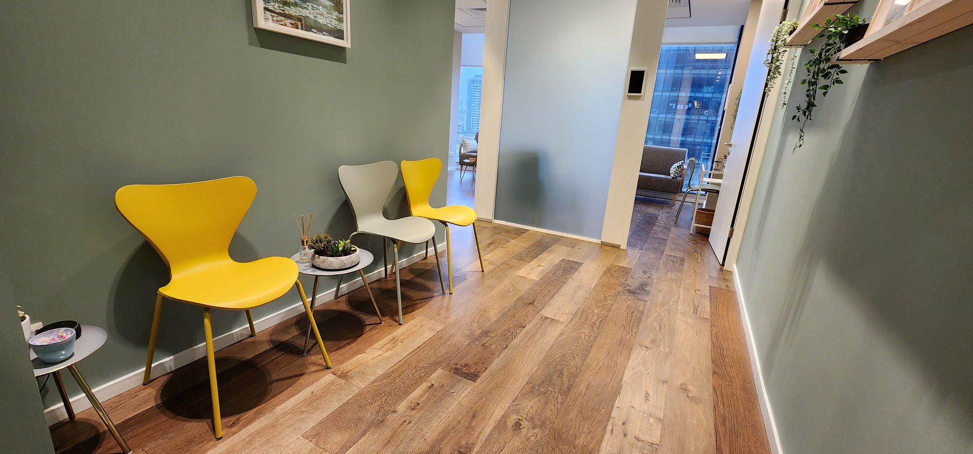 Waiting room with chairs and wooden floor. therapy room rental website