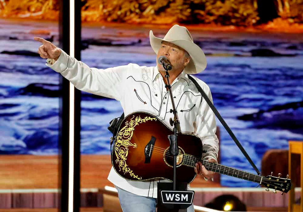 Alan Jackson performing at Opry 100 show