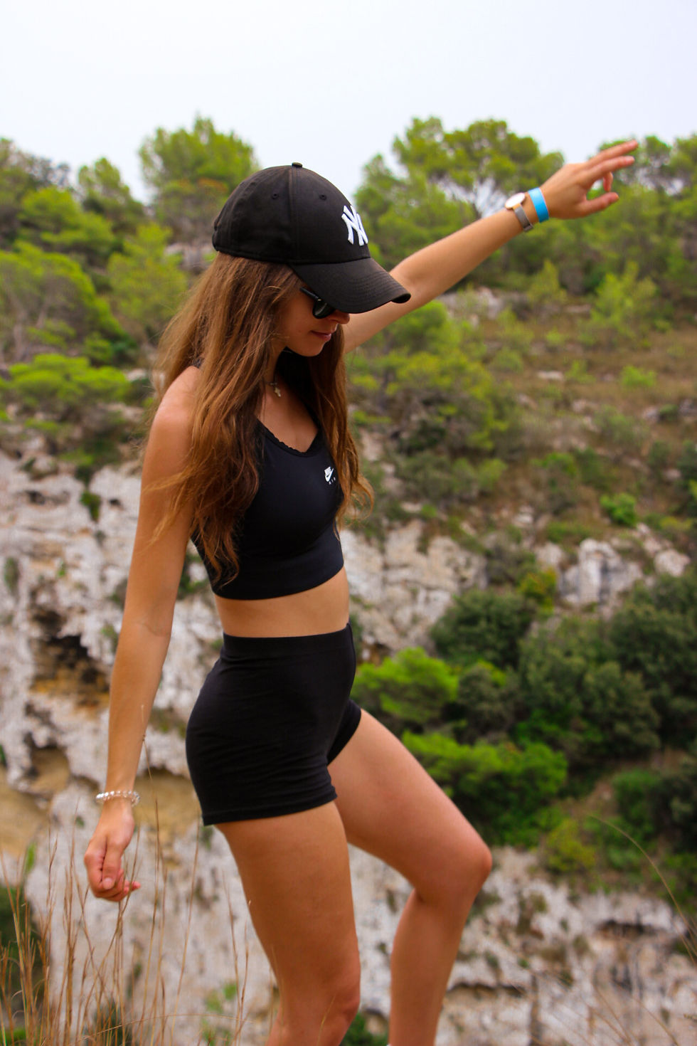 Girl dressed in black sports clothes in the Algendar ravine.