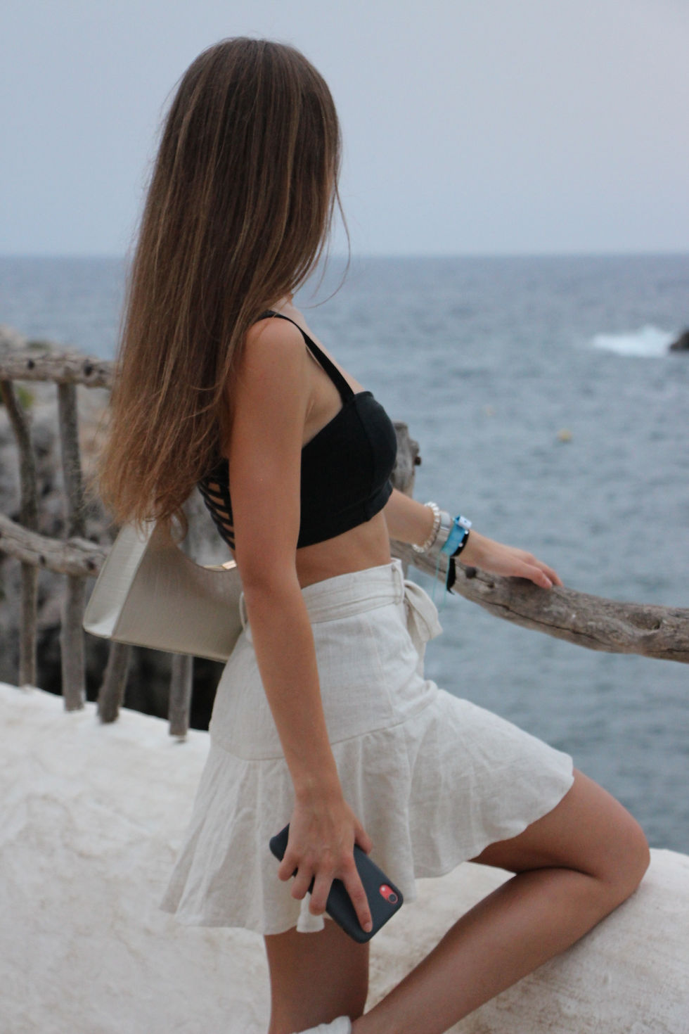 Girl posing with sea sights.