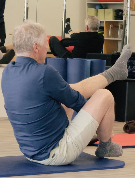 Client practising authentic mat Pilates on a studio mat at Scoop Pilates in Ferrymead Christchurch