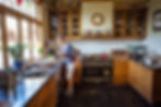 Photo of Ann preparing a delicious home-cooked breakfast at Hurunui Homestead, Canterbury luxury accommodation
