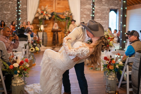bride and groom in rustic vintage barn country wedding ceremony in Toledo Wa Lewis County